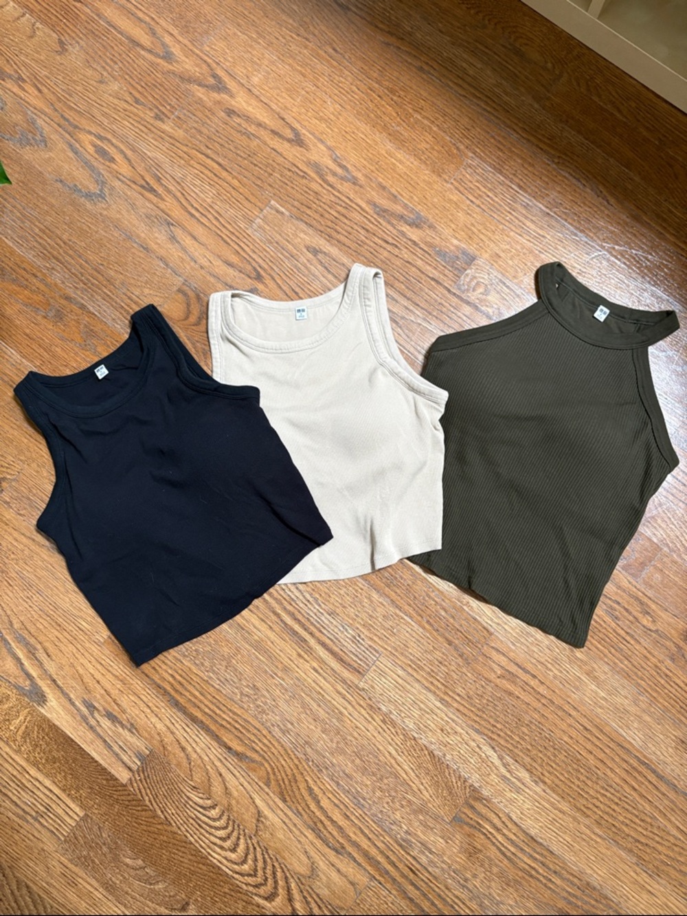 3 Uniqlo cropped ribbed tanks with built in bra